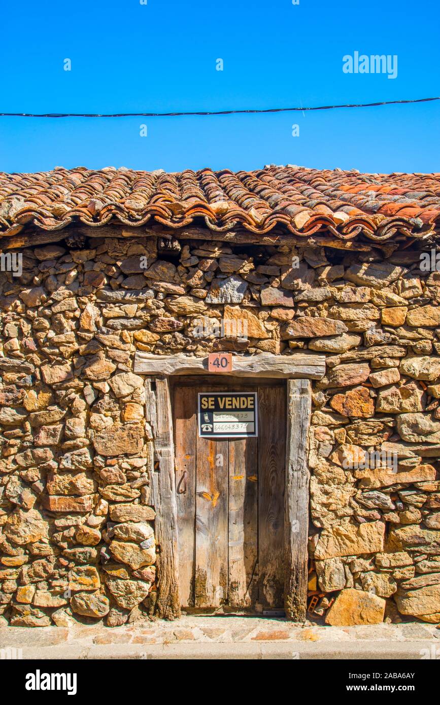 Old granary on sale. Villavieja del Lozoya, Madrid province, Spain. Stock Photo