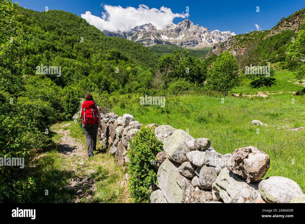 Woman hiking in Panticosa, Tena Valley, Partacua Mountain Range, Pyrenees (Huesca province, Aragón, Spain) Stock Photo