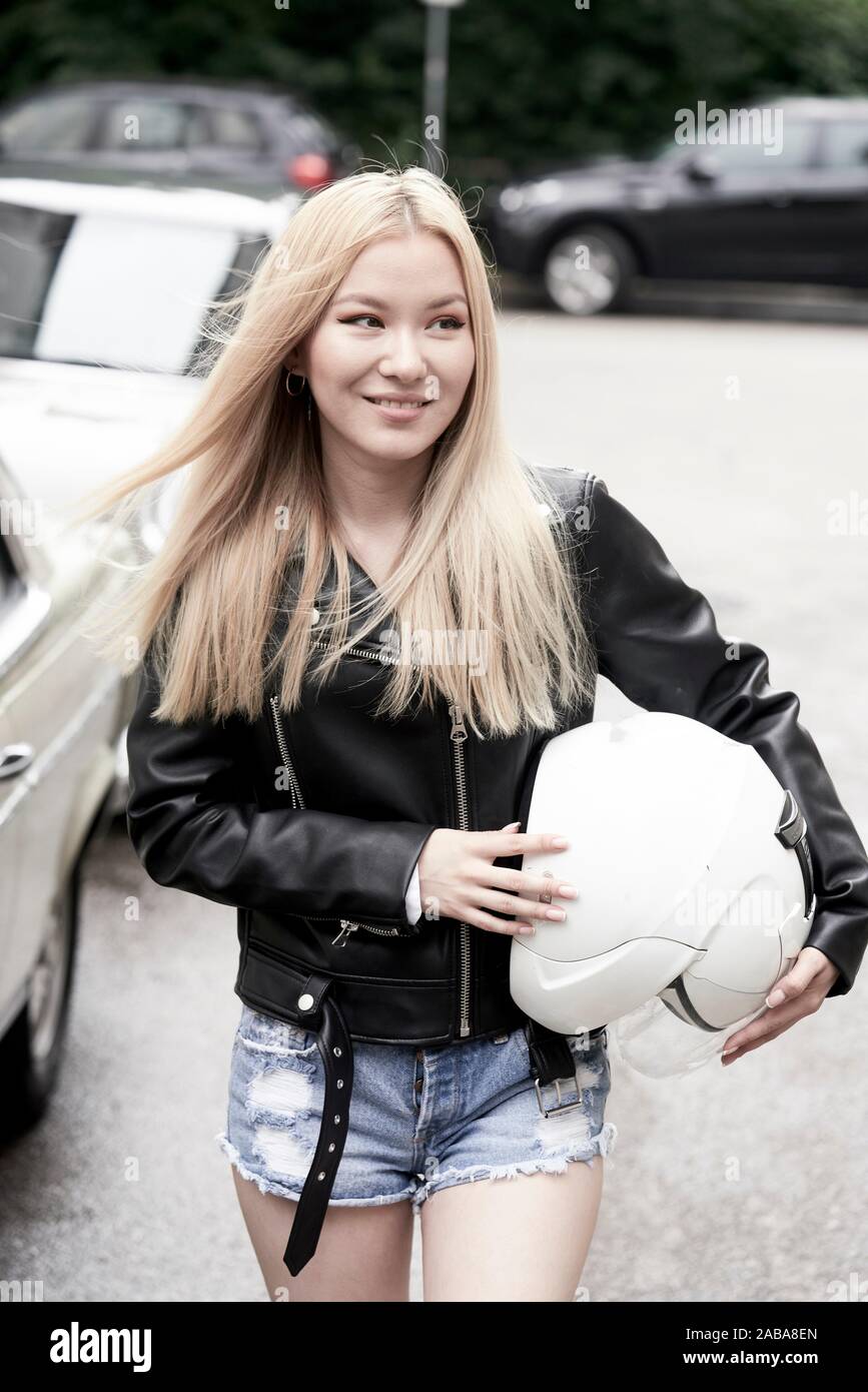Asian womam with crash helmet. Munich, Germany Stock Photo Alamy