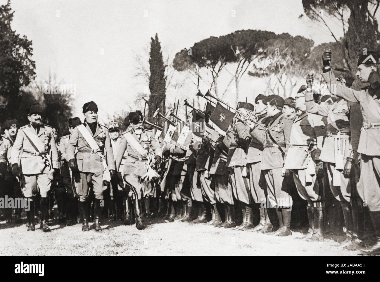 Benito Mussolini inspecting troops.  Benito Amilcare Andrea Mussolini, 1883 - 1945.  27th Prime Minister of Italy.  Also known as Il Duce, or The Leader.  Head of Italian government during World War II. Stock Photo
