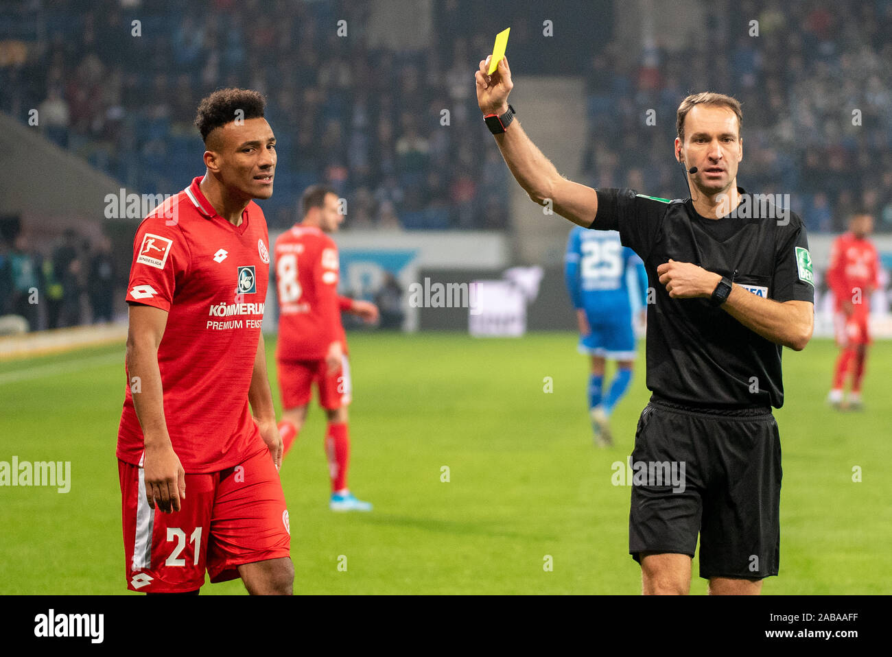 SINSHEIM, GERMANY - NOVEMBER 24: Schiedsrichter Bastian Dankert shows Karim Onisiwo (1.FSV Mainz 05) the vellow card at the Football, Bundesliga 2019/2020 - TSG 1899 Hoffenheim v 1. FSV Maiz 05 at the PreZero Arena on November 24, 2019 in Sinsheim, GERMANY. Stock Photo