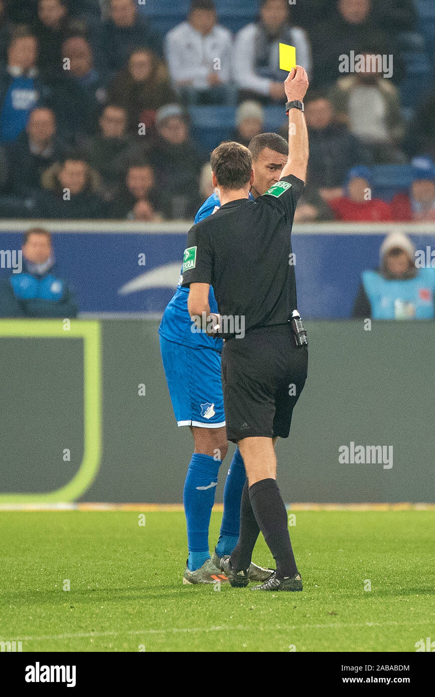 SINSHEIM, GERMANY - NOVEMBER 24: Schiedsrichter Bastian Dankert shows Kevin Akpoguma (TSG 1899 Hoffenheim) the vellow card at the Football, Bundesliga 2019/2020 - TSG 1899 Hoffenheim v 1. FSV Maiz 05 at the PreZero Arena on November 24, 2019 in Sinsheim, GERMANY. Stock Photo