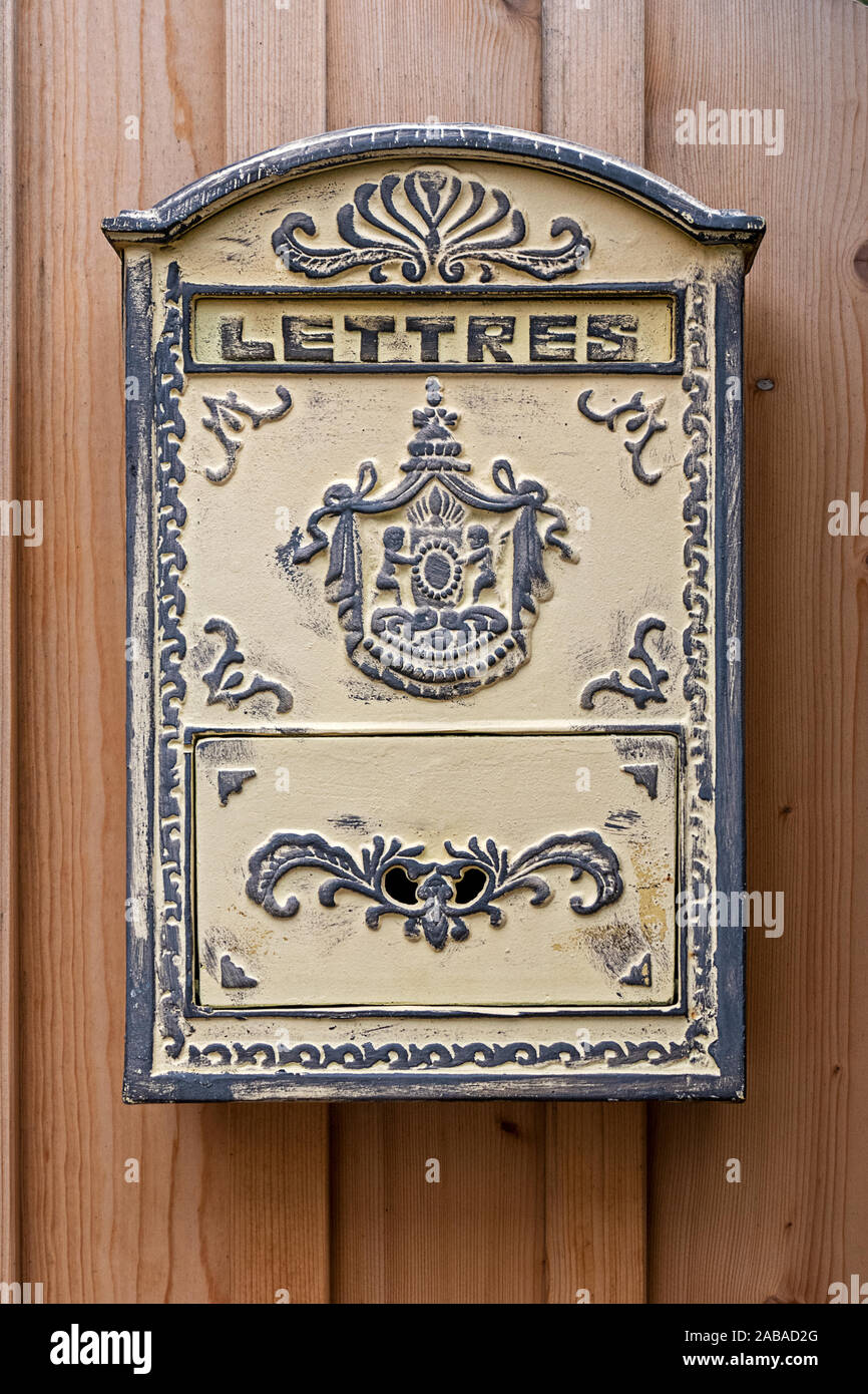 old beautifully decorated post box with the inscription in french language lettres in english letters Stock Photo