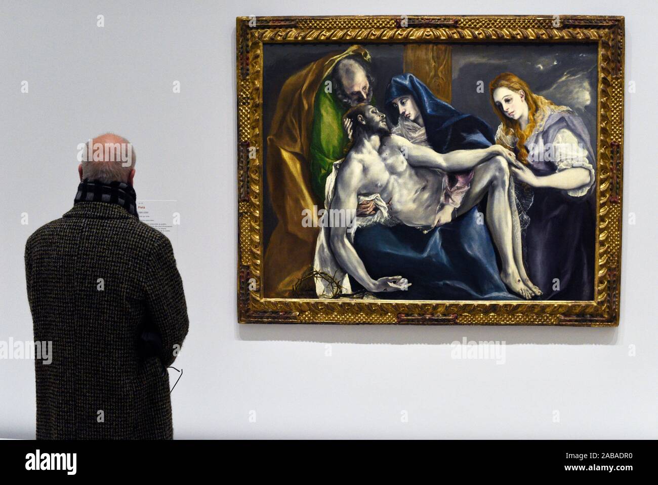 Visitor looks at a painting of El Greco at the exhibition at the Grand Palais in Paris. Stock Photo