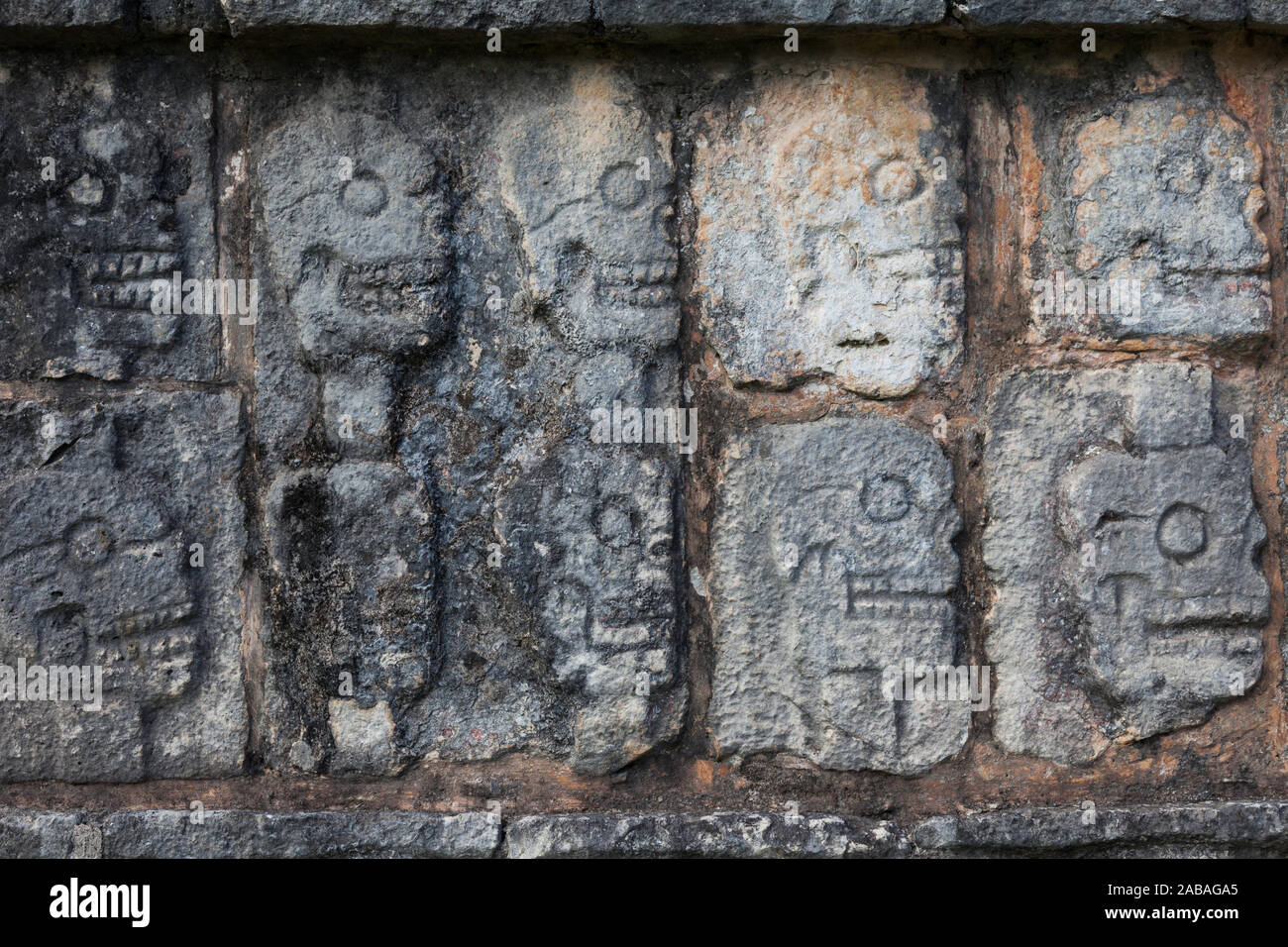 Wall of skulls called the Tzompantli at the Chichen Itza cultural centre on the Yucatan peninsula of Mexico Stock Photo