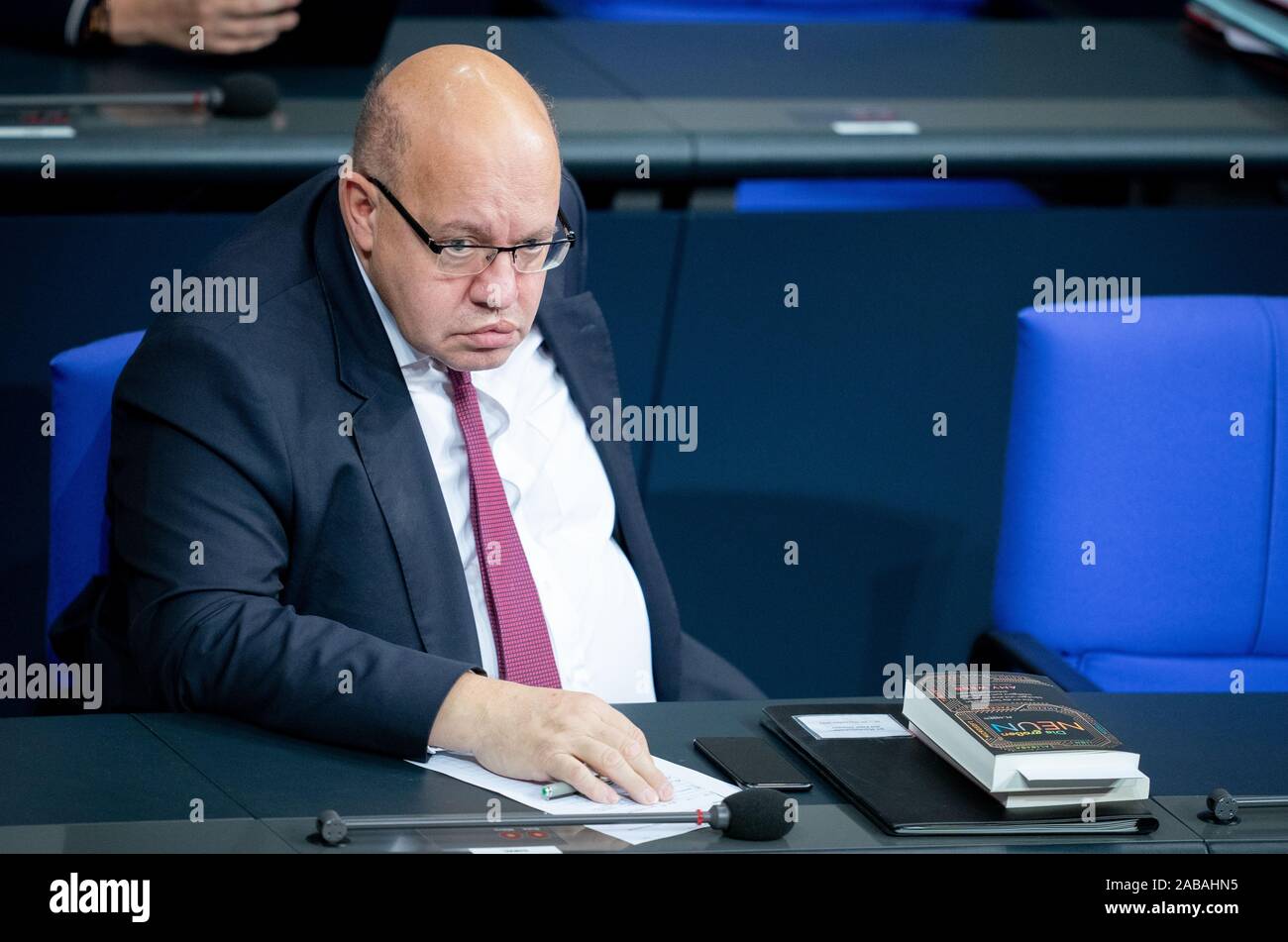Berlin, Germany. 26th Nov, 2019. Peter Altmaier (CDU), Federal Minister of Economics and Energy, takes part in the debate on the Federal Budget 2020 in the Bundestag. Next to Altmaier is the book 'The Big Nine: How to Tame the Tech Titans and Develop Artificial Intelligence for the Benefit of All' by Amy Webb. Credit: Kay Nietfeld/dpa/Alamy Live News Stock Photo
