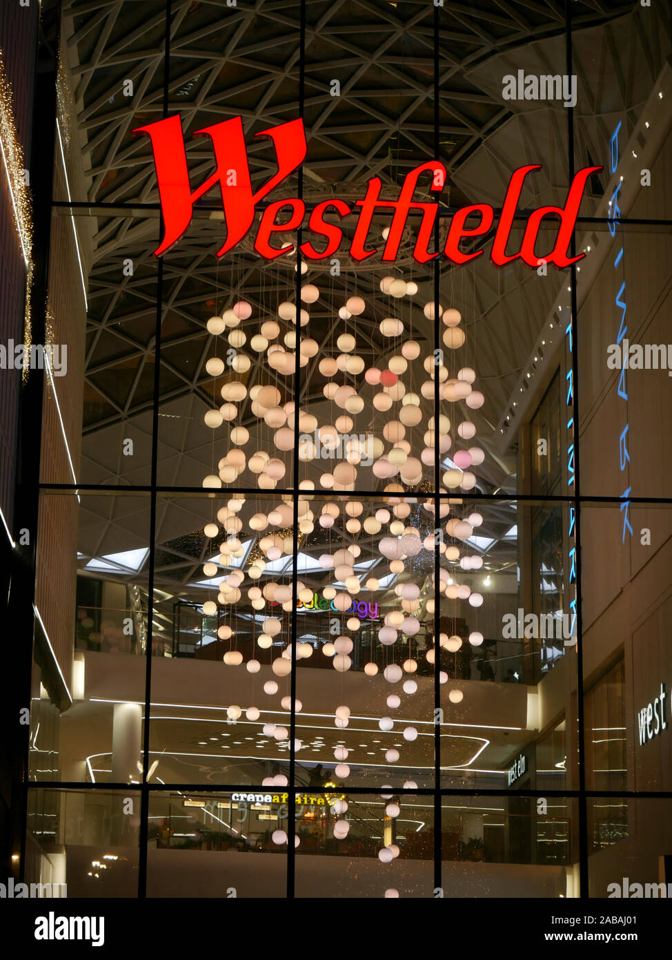 One of the entrances to Westfield Shopping Centre, White City, London, UK at Christmas Stock Photo