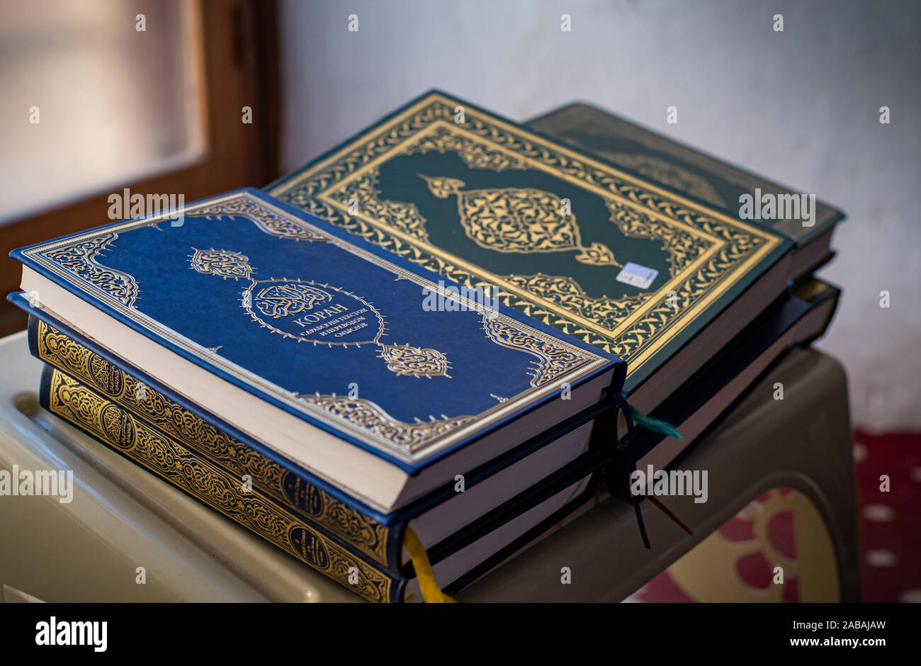 Stack of closed korah or koran  Islamic religious books full of prayers Stock Photo