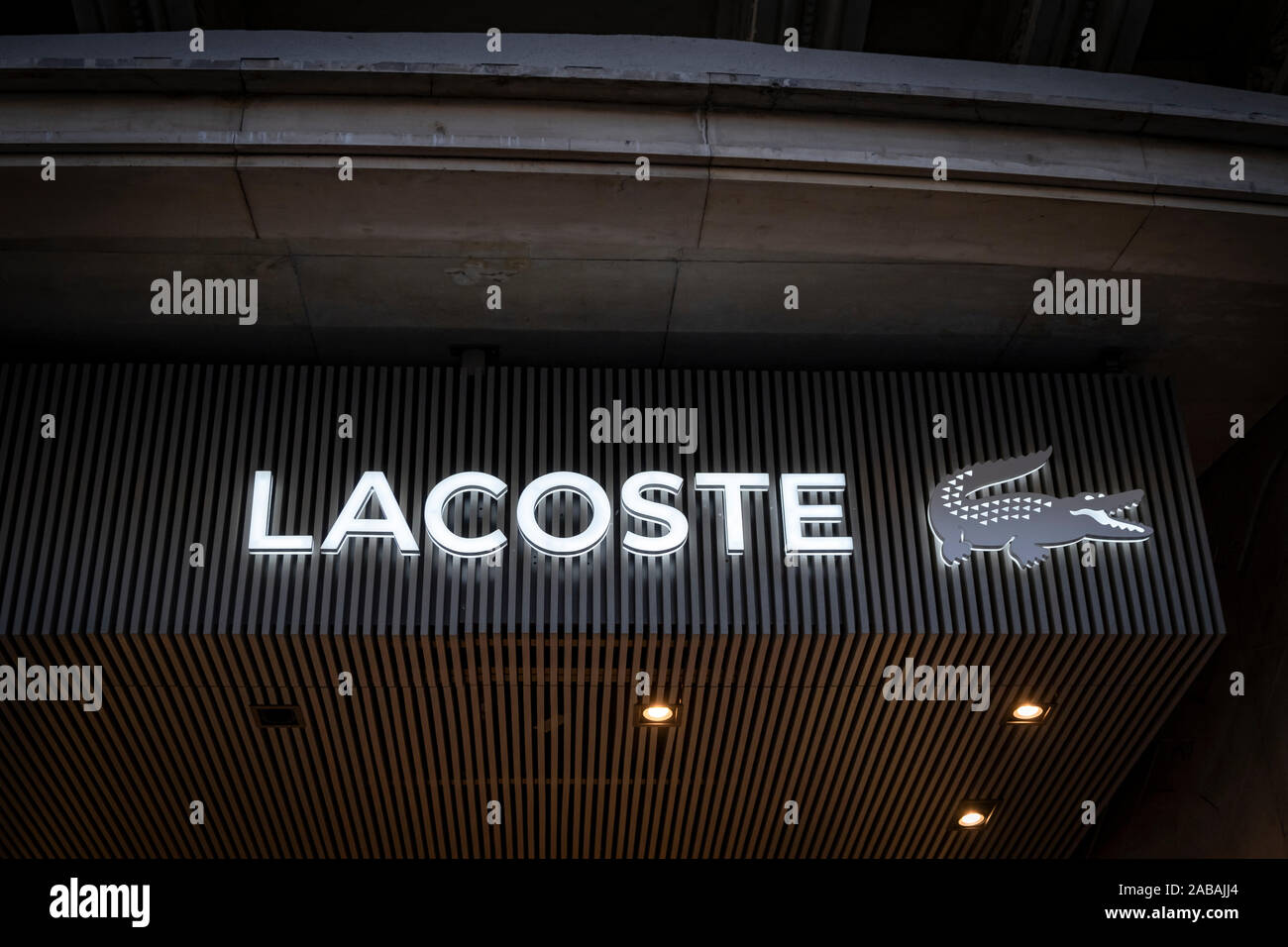 logo of Lacoste, French manufacturer of luxury and accessories seen at the Passeig de Gràcia store.A boulevard of just over a kilometre, the Passeig de Gràcia store brings