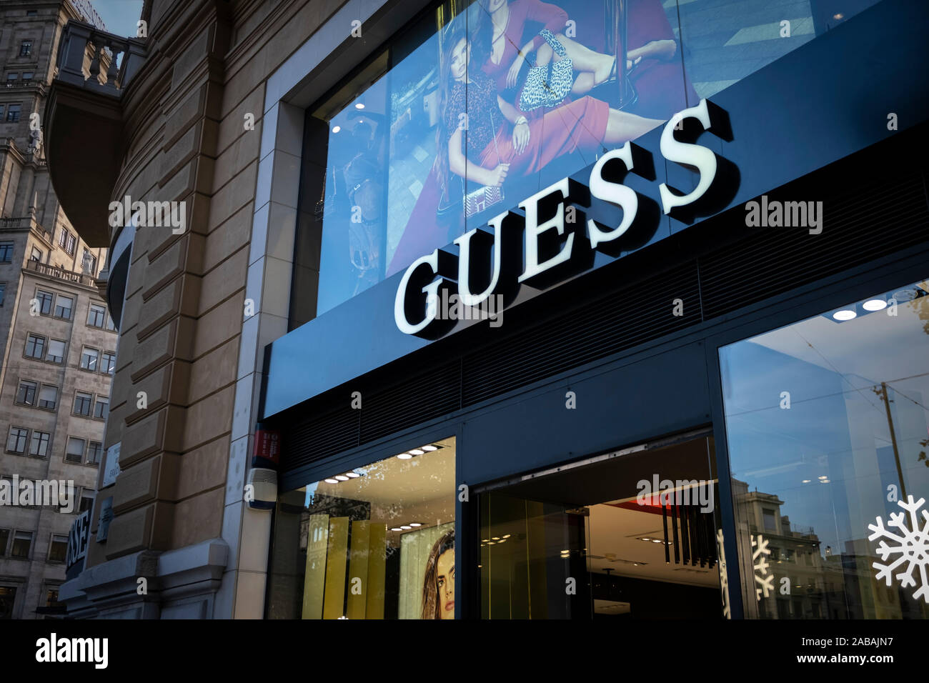 The GUESS logo, Italian brand of luxury clothing and accessories  manufacturer, seen at the Passeig de