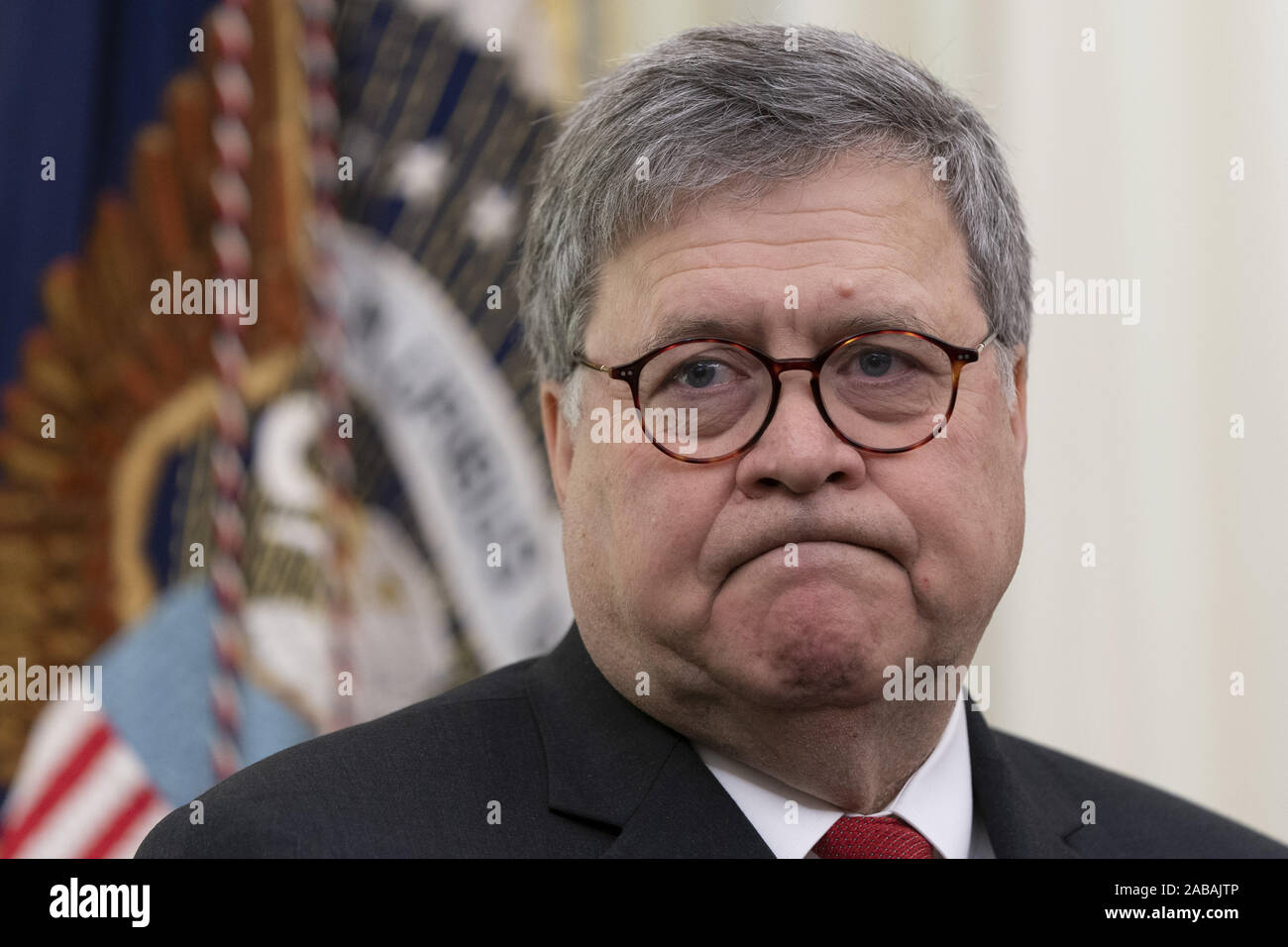 Washington, United States. 26th Nov, 2019. United States Attorney General William P. Barr listens as United States President Donald J. Trump signs an Executive Order Establishing the Task Force on Missing and Murdered American Indians and Alaska Natives at the White House in Washington, DC on Tuesday, November 26, 2019. Photo by Chris KleponisUPI Credit: UPI/Alamy Live News Stock Photo