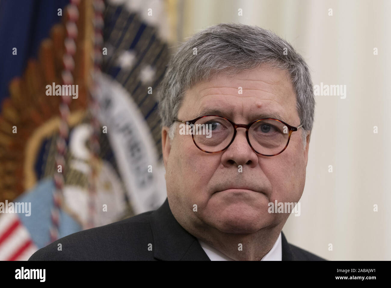 Washington, United States. 26th Nov, 2019. United States Attorney General William P. Barr listens as United States President Donald J. Trump signs an Executive Order Establishing the Task Force on Missing and Murdered American Indians and Alaska Natives at the White House in Washington, DC on Tuesday, November 26, 2019. Photo by Chris KleponisUPI Credit: UPI/Alamy Live News Stock Photo