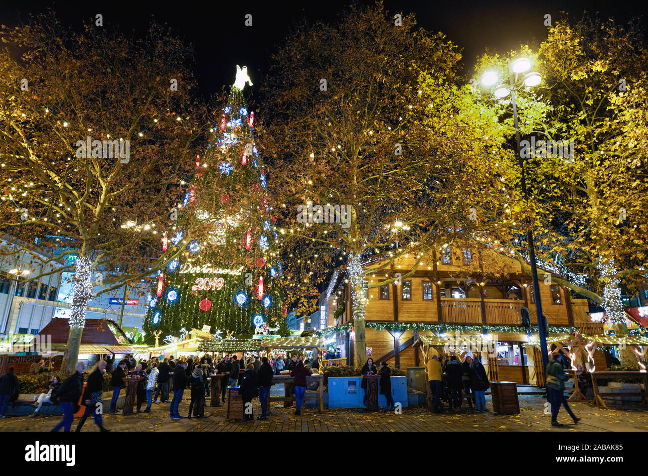 Dortmund/Germany, 26.11.2019 - The supposedly tallest Christmas tree in the  world at the Dortmund Christmas Market. On a steel framework are 1700  spruces, illuminated with 48,000 LED lights and an angel on