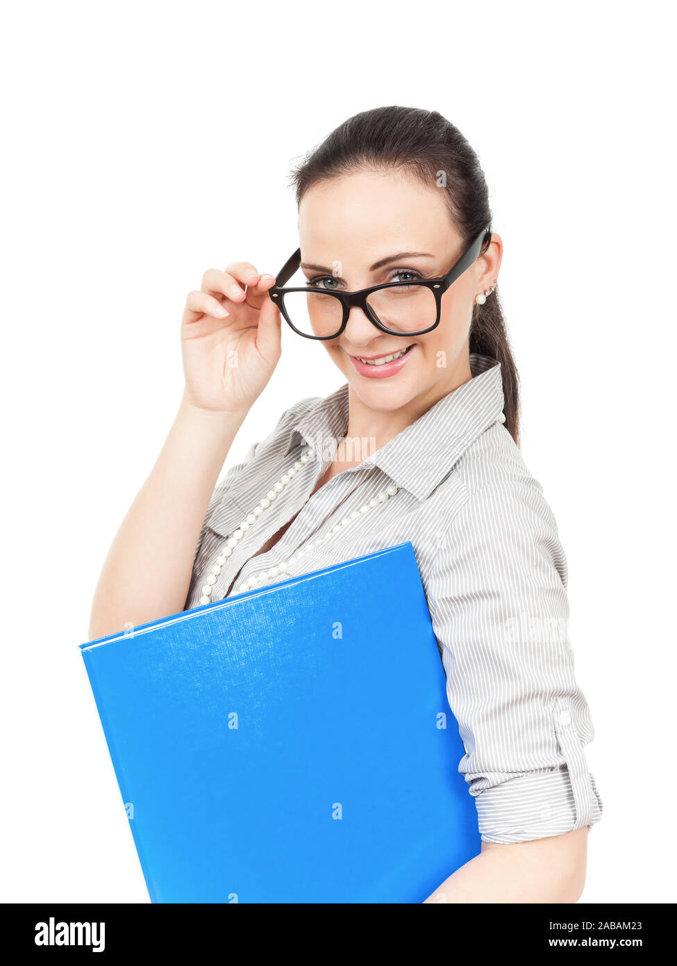 Eine tuechtige Geschaeftsfrau mit Brille und blauem Ordner vor weissem Hintergrund Stock Photo