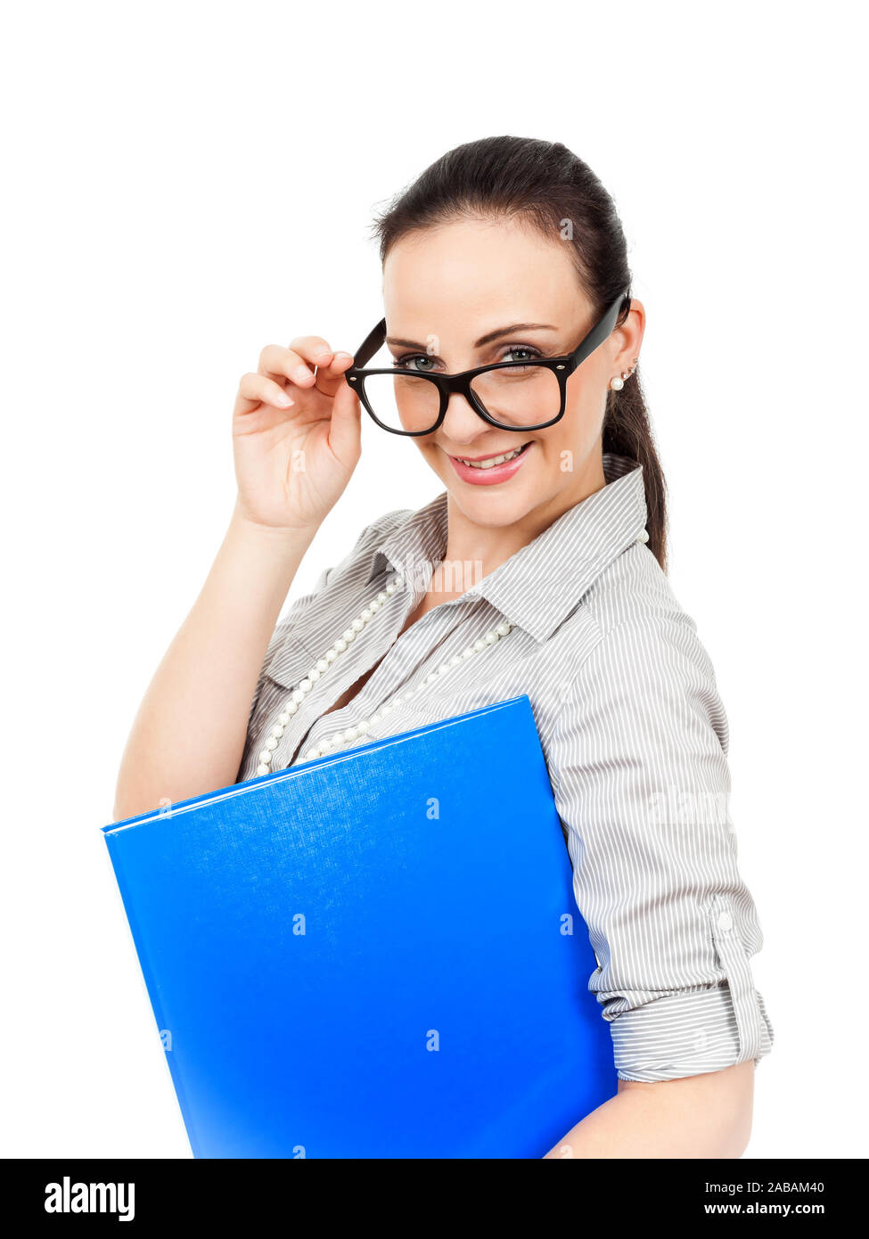 Eine tuechtige Geschaeftsfrau mit Brille und blauem Ordner vor weissem Hintergrund Stock Photo