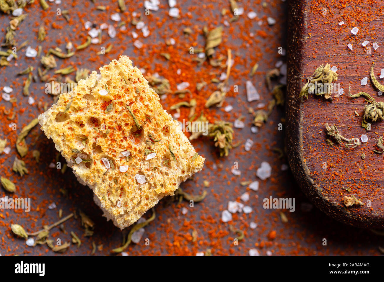 Top view of crouton with salt and spices over wood table Stock Photo