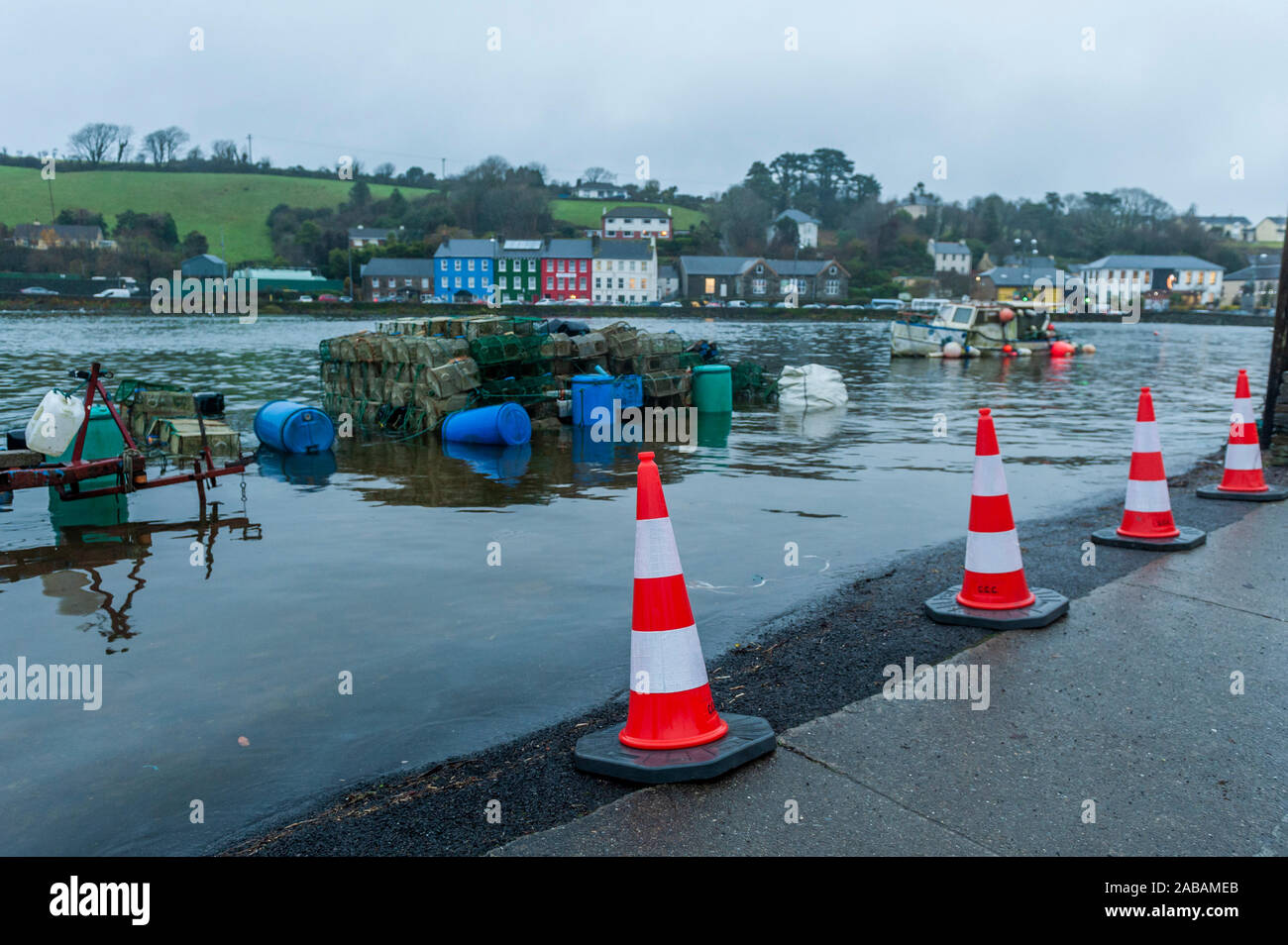Bantry, West Cork, Ireland. 26th Nov, 2019. Bantry flooded this evening due to a 5.16m spring tide. The high tides are expected to bring more flooding tonight and tomorrow. Bantry Quays were coned off from early afternoon to prevent cars from parking and getting trapped when the flood waters came. Credit: Andy Gibson/Alamy Live News Stock Photo
