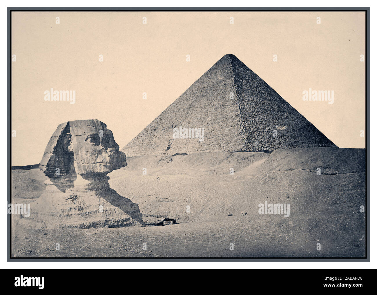 1880's Vintage Giza. Pyramid of Khafre and Sphinx 1880's B&W sepia image of Giza. ca. 2575 BC-ca. 2465 BC (Pyramid and Sphinx) Pyramids of Giza, Muḩāfaz̧at Maţrūḩ, Egypt Africa Egyptian Egyptian ancient, 4th Dynasty Great Sphinx of Giza, commonly referred to as the Sphinx of Giza or just the Sphinx, is a limestone statue of a reclining sphinx, a mythical creature with the body of a lion and the head of a human Facing directly from West to East, it stands on the Giza Plateau on the west bank of the Nile in Giza, Egypt. Stock Photo