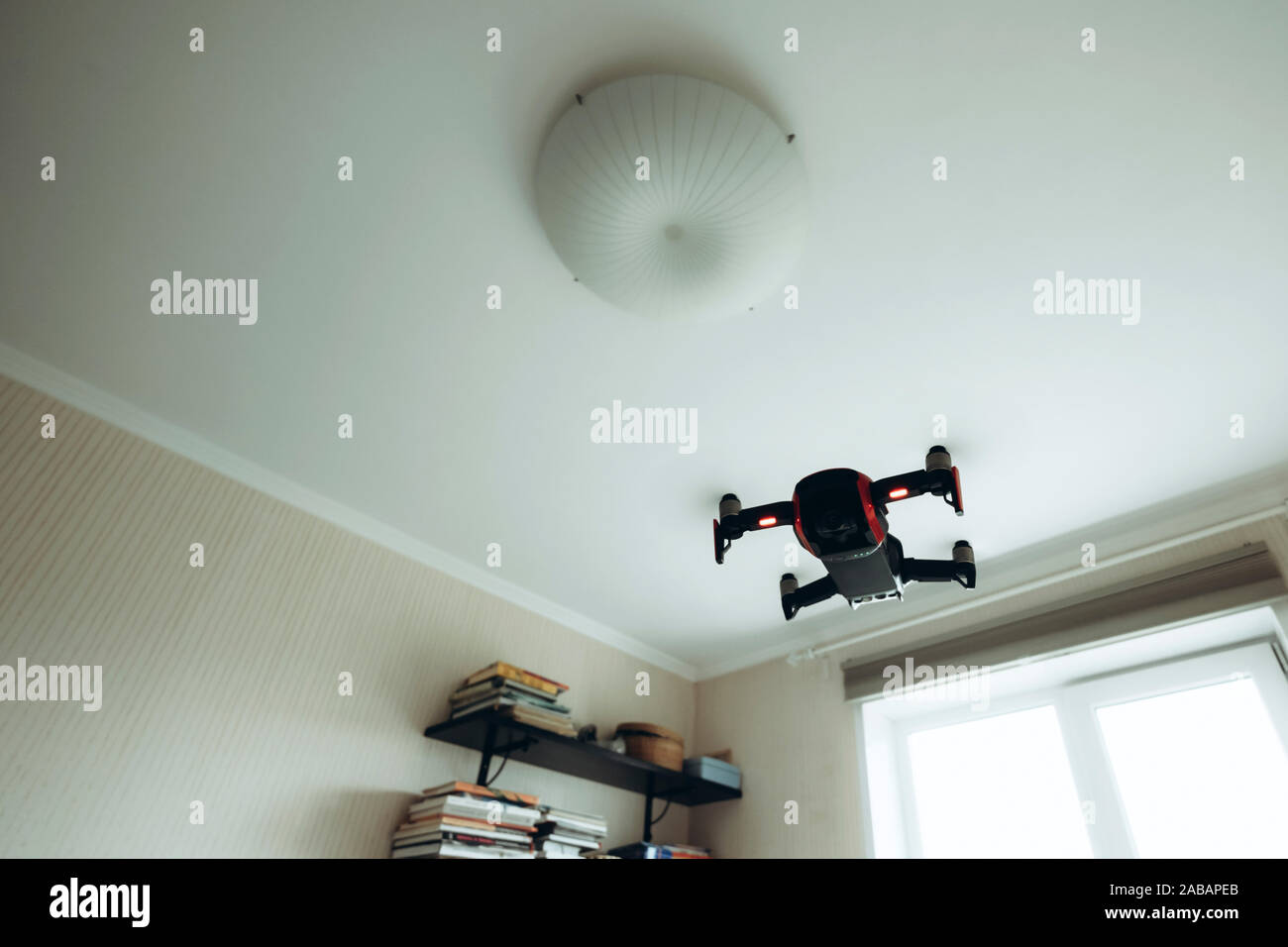 Drone flying indoors inside house. Modern trendy technology