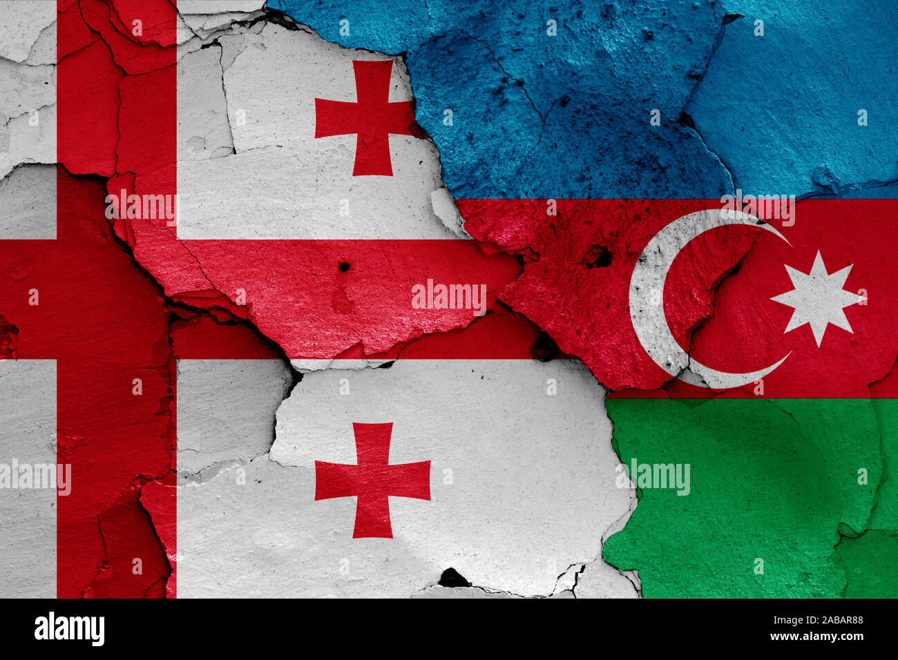 flags of Georgia and Azerbaijan painted on cracked wall Stock Photo