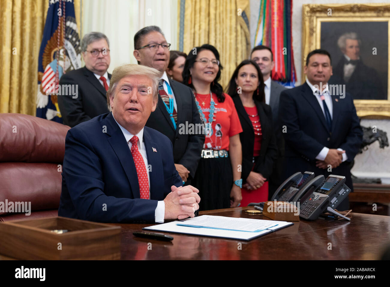 Washington, United States Of America. 26th Nov, 2019. United States President Donald J. Trump signs an Executive Order Establishing the Task Force on Missing and Murdered American Indians and Alaska Natives in the Oval Office of White House in Washington, DC on Tuesday, November 26, 2019.Credit: Chris Kleponis/Pool via CNP Photo via Credit: Newscom/Alamy Live News Stock Photo