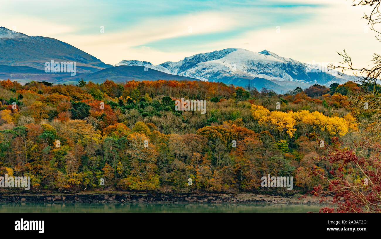 Mount Snowdon, viewed from Anglesey (Ynys Mon), looking accross the Menai Straits. Taken in November 2019. Stock Photo