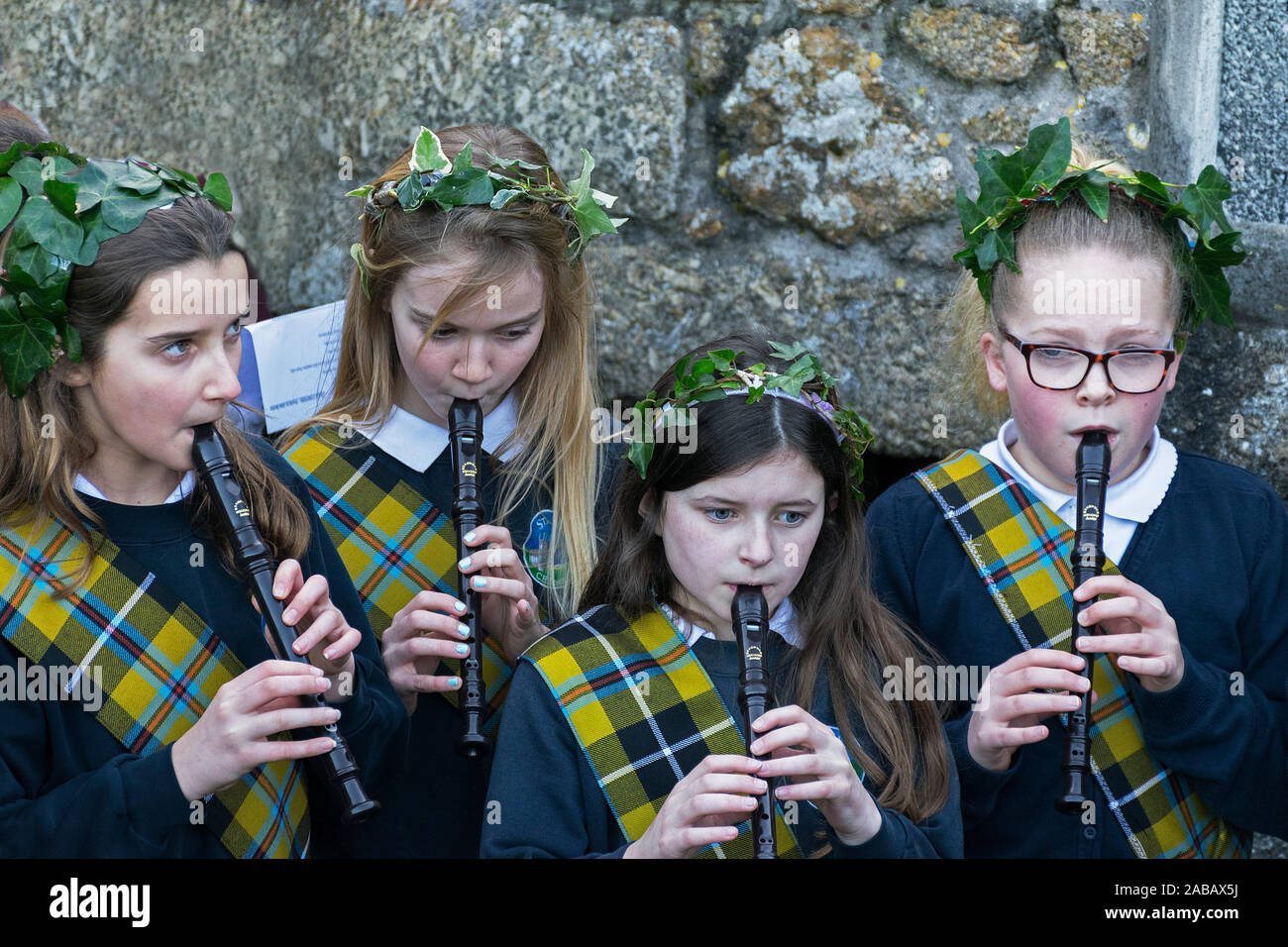 four schoolgirls playing the flute flutes Stock Photo