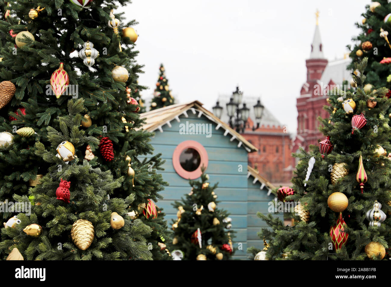 Christmas trees on Red square in Moscow, New Year celebration in Russia. Festive decorations on background of Kremlin tower, magic of the holiday Stock Photo