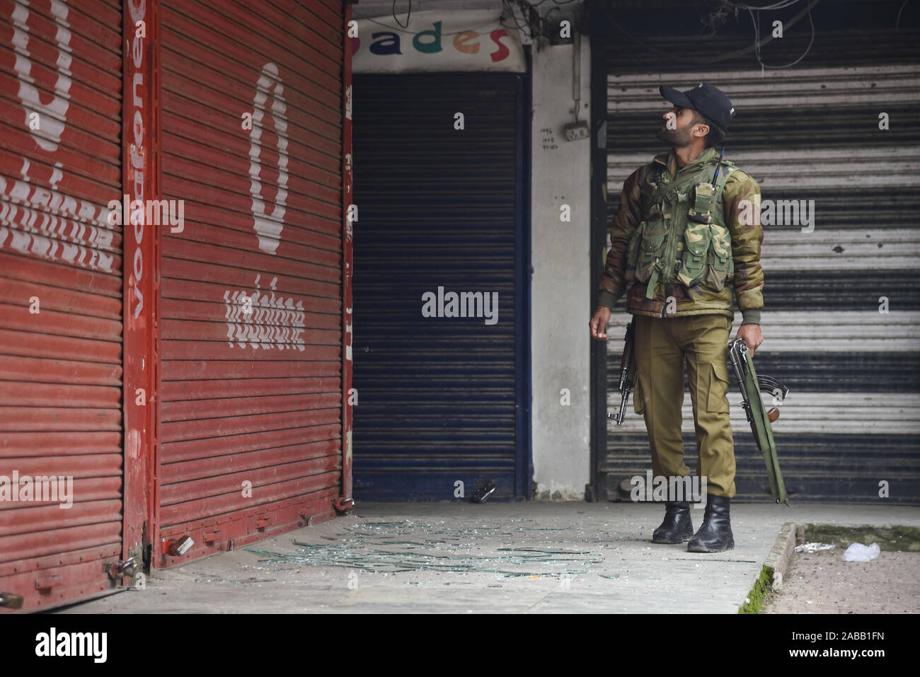 An Indian policeman inspects the site of the blast.At least three people were wounded in a low-intensity blast which took place at Hazratbal locality in Srinagar city, the summer capital of Indian-administered Kashmir, Police said. Stock Photo