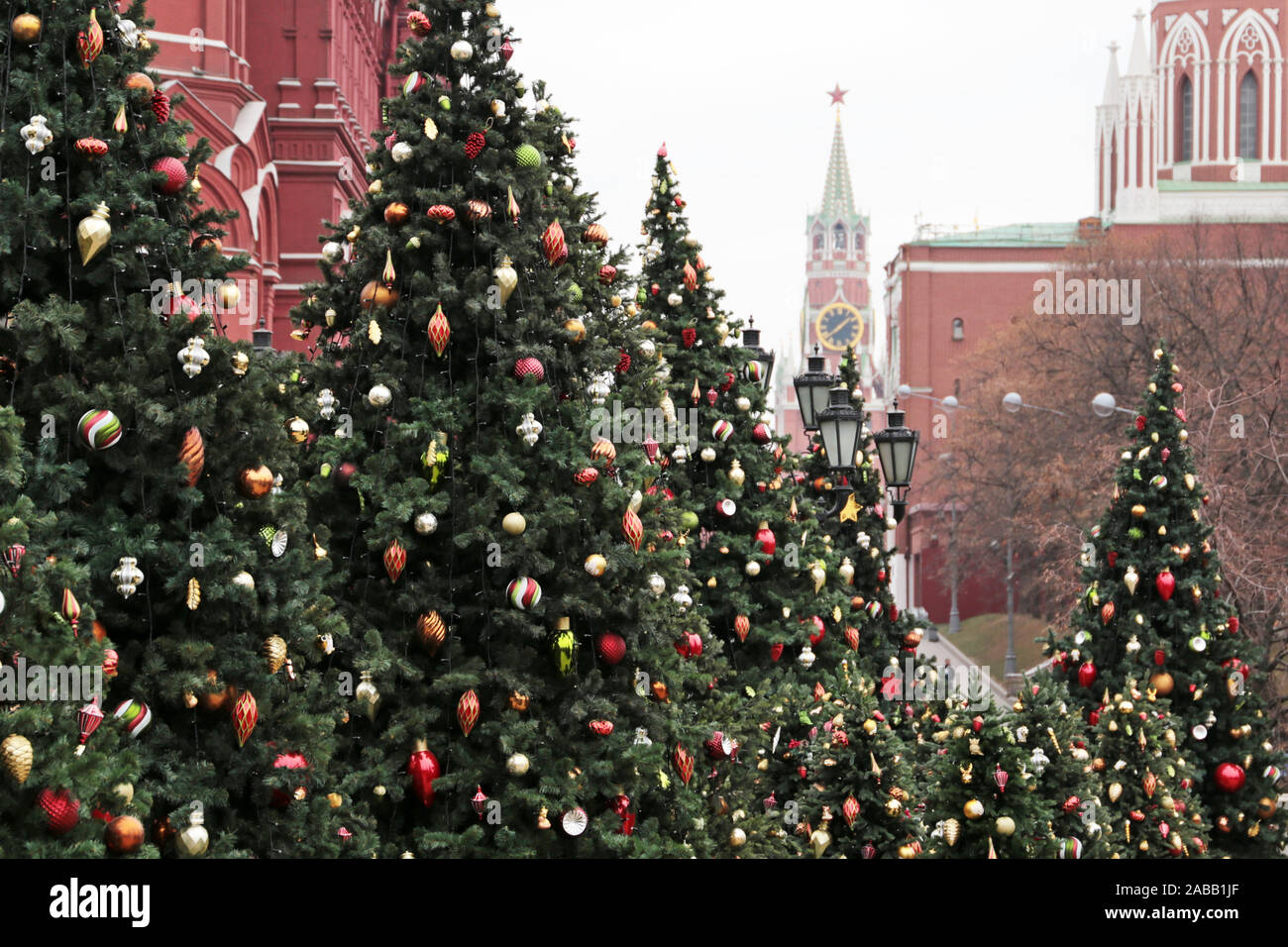Christmas trees on Red square in Moscow, New Year celebration in Russia. Festive decorations on background of Kremlin tower, magic of the holiday Stock Photo