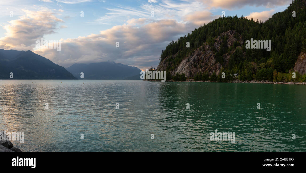 Beautiful Panoramic View of Howe Sound surrounded by Canadian Mountain Landscape during summer sunset. Taken in Porteau Cove, North of Vancouver, BC, Stock Photo