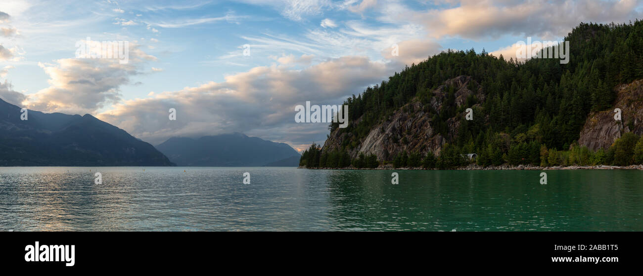 Beautiful Panoramic View of Howe Sound surrounded by Canadian Mountain Landscape during summer sunset. Taken in Porteau Cove, North of Vancouver, BC, Stock Photo