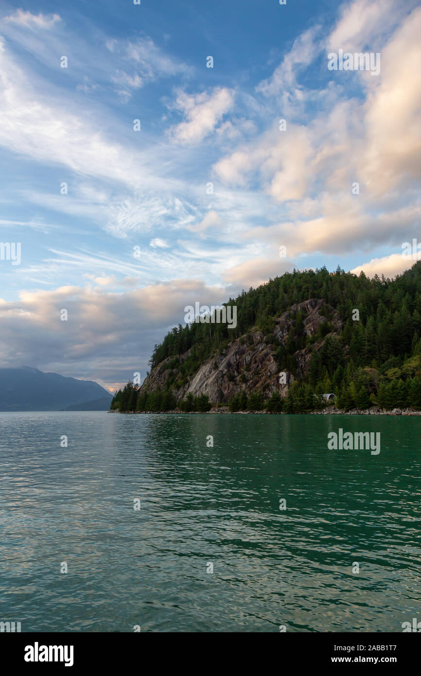 Beautiful View of Howe Sound surrounded by Canadian Mountain Landscape during summer sunset. Taken in Porteau Cove, North of Vancouver, BC, Canada. Stock Photo