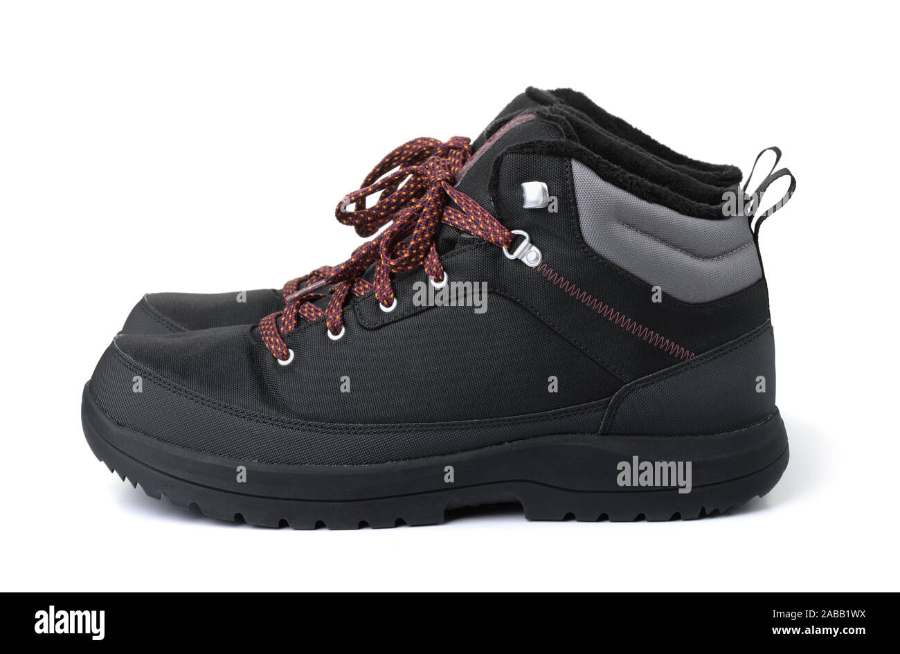 Side view of black waterproof hiking boots isolated on white Stock