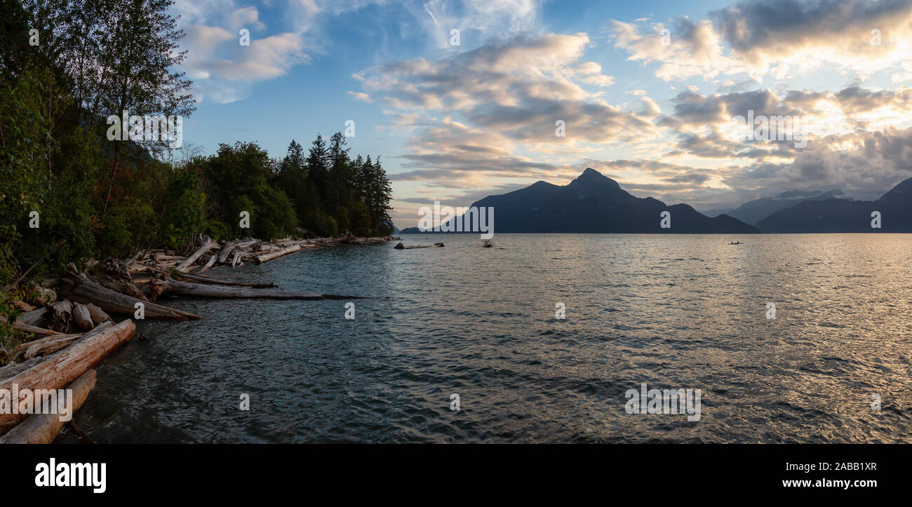 Beautiful Panoramic View of Howe Sound surrounded by Canadian Mountain Landscape during summer sunset. Taken in Porteau Cove, North of Vancouver, BC, Stock Photo