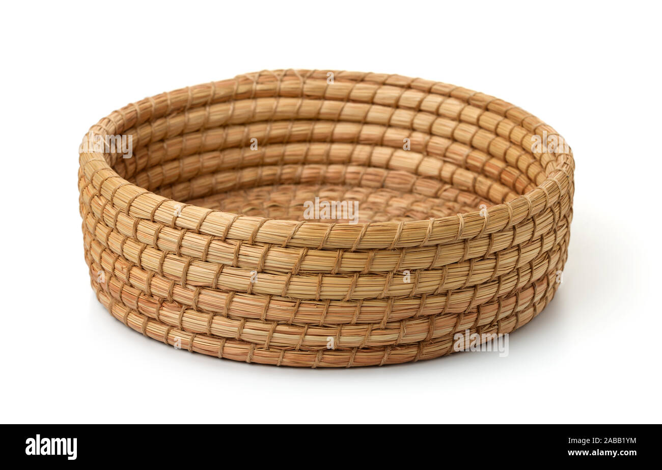 Round cane wicker basket tray isolated on white Stock Photo