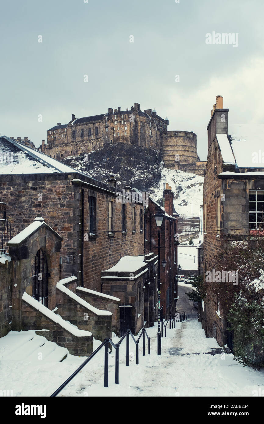 View of Edinburgh Castle after snow from the historic Vennel steps at Grassmarket in Edinburgh Old Town, Scotland, United Kingdom Stock Photo