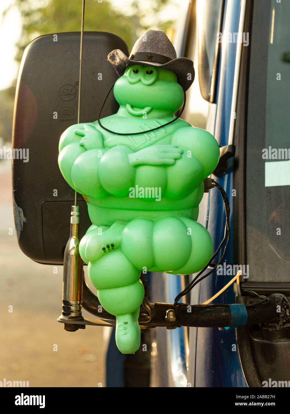 green version of the Michelin Man Bibendum on the front of a truck in Kuala Lumpur malaysia Stock Photo