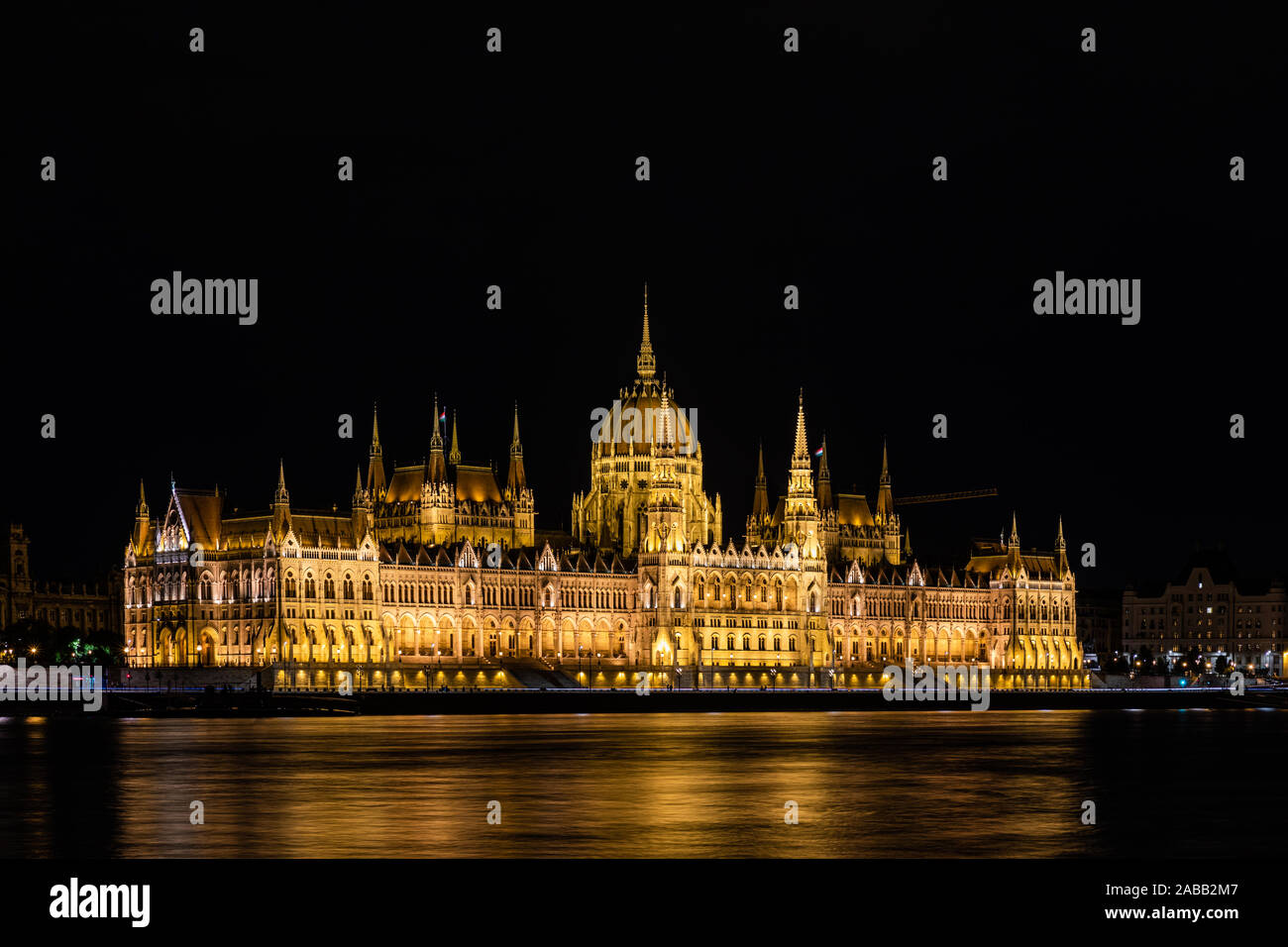 Stunning view of the Hungarian Parliament Building at the bank of River Danube at night in Budapest, Hungary Stock Photo