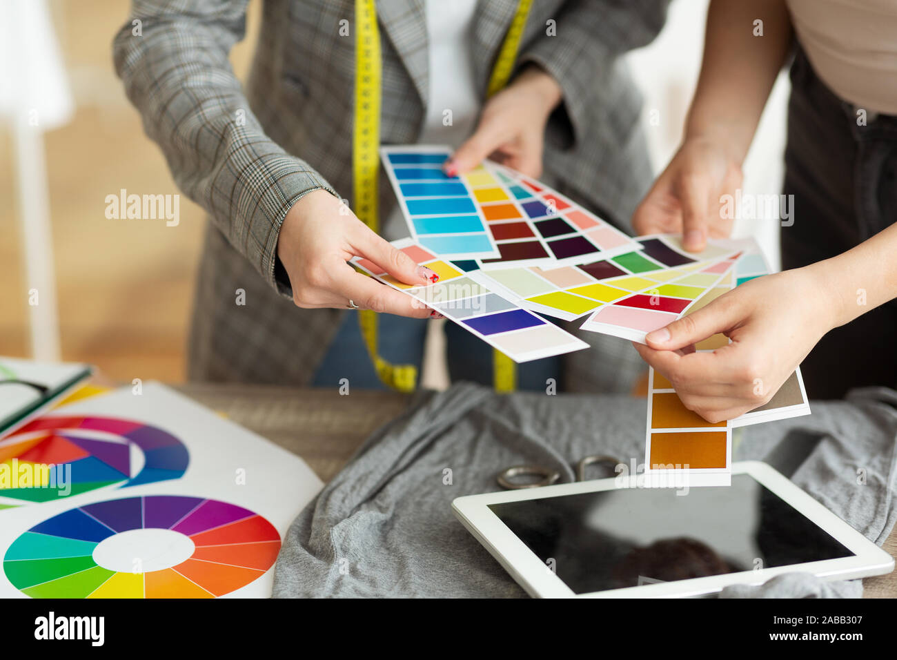 Fashion designer choosing color samples in atelier Stock Photo