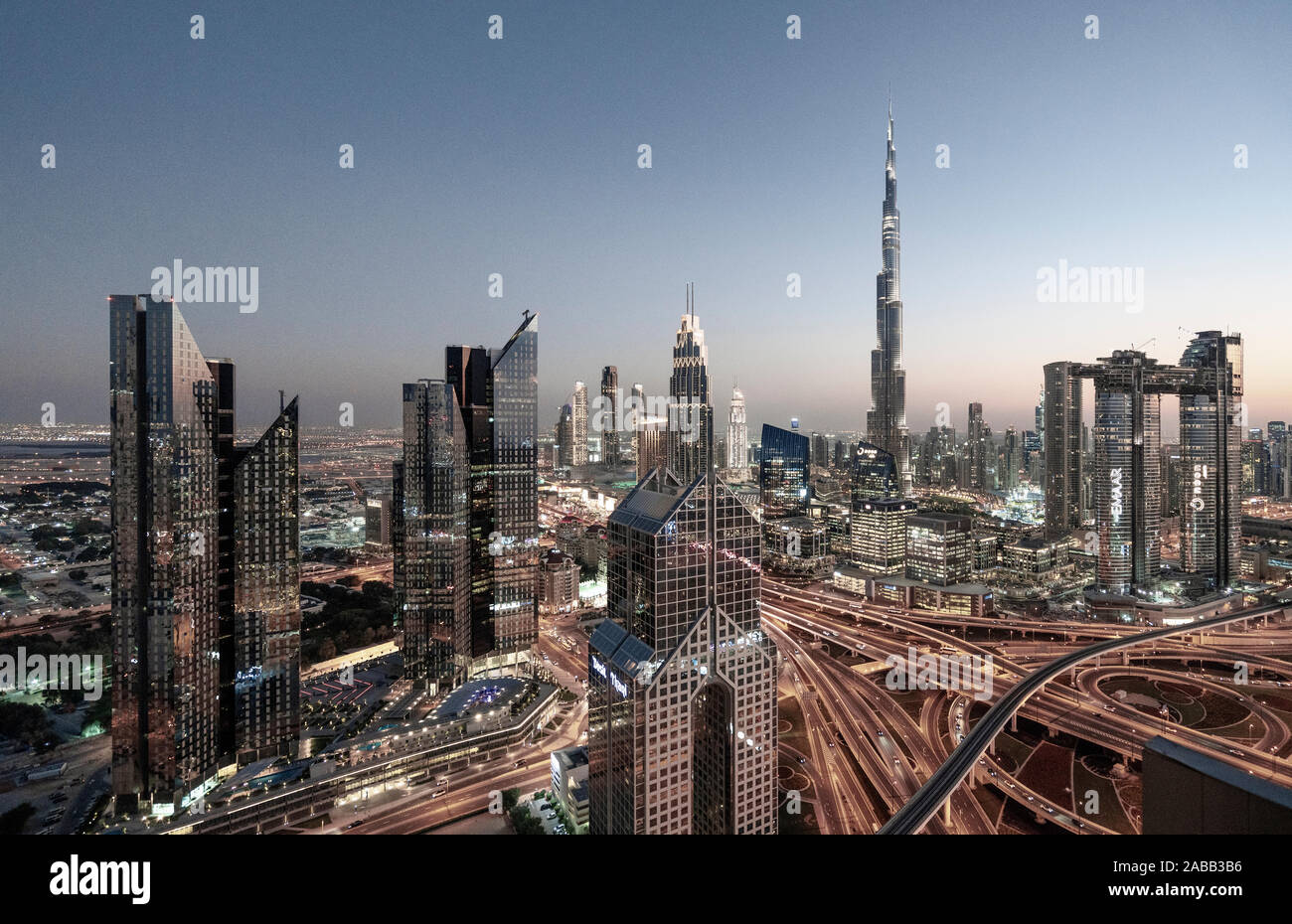 Skyline of Dubai, Sheikh Zayed Road and Burj Khalifa skyscraper at dusk in Dubai, United Arab Emirates Stock Photo