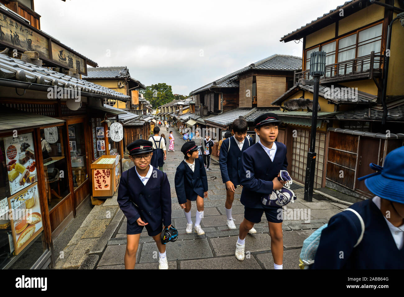 Kyoto, Japan - 10/30/19 - Boys in old fashioned school uniform in the old streets around the Kiyomizu-dera temple complex. Stock Photo