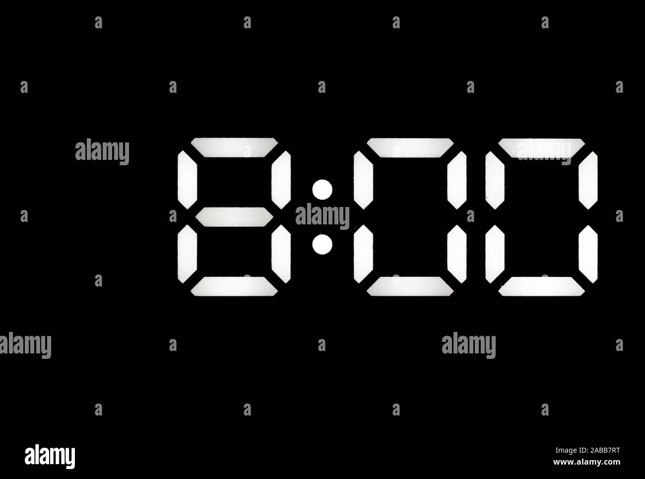 Real white led digital clock on a black background showing time 800