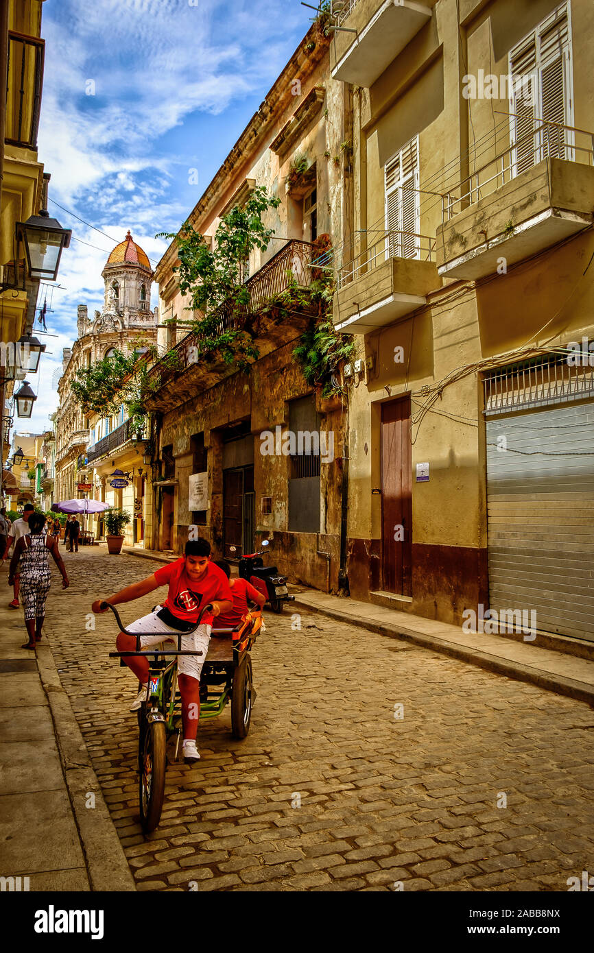 Havana, Cuba, July 2019, boys on a bike in San Ignacio street Stock Photo