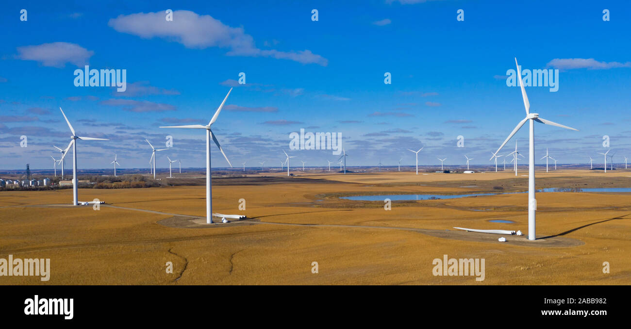Valley City, North Dakota - Wind farm. Replacement blades are stacked near some of the turbines. Stock Photo