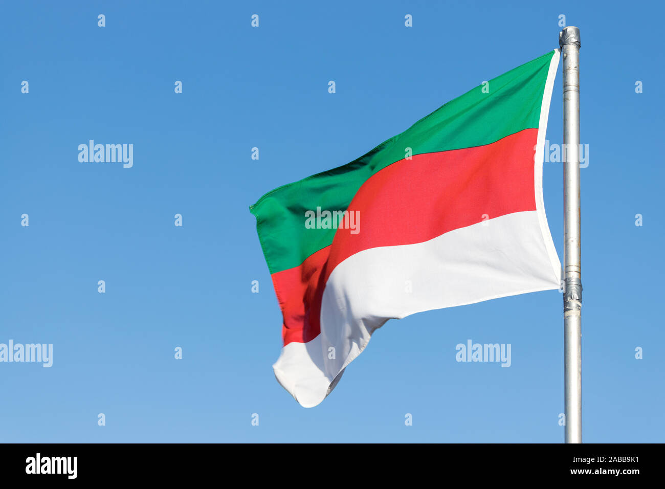 flag of Heligoland flying in the wind Stock Photo