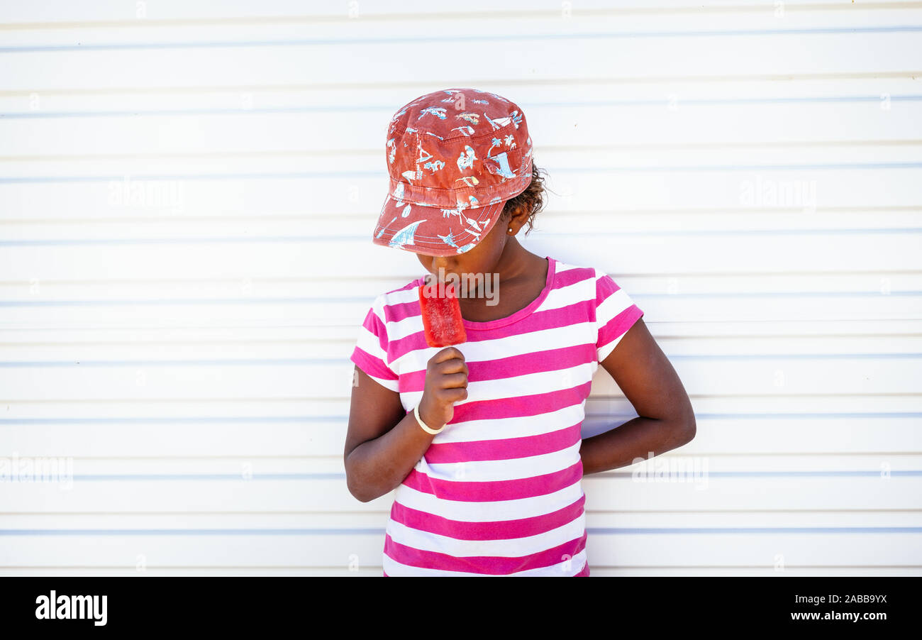 Portrait of a girl eating an ice lolly Stock Photo