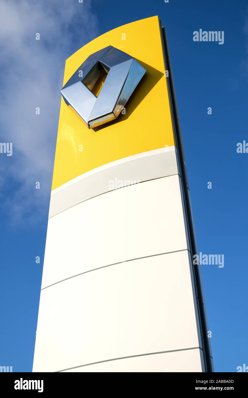 Renault dealership sign against blue sky Stock Photo Alamy