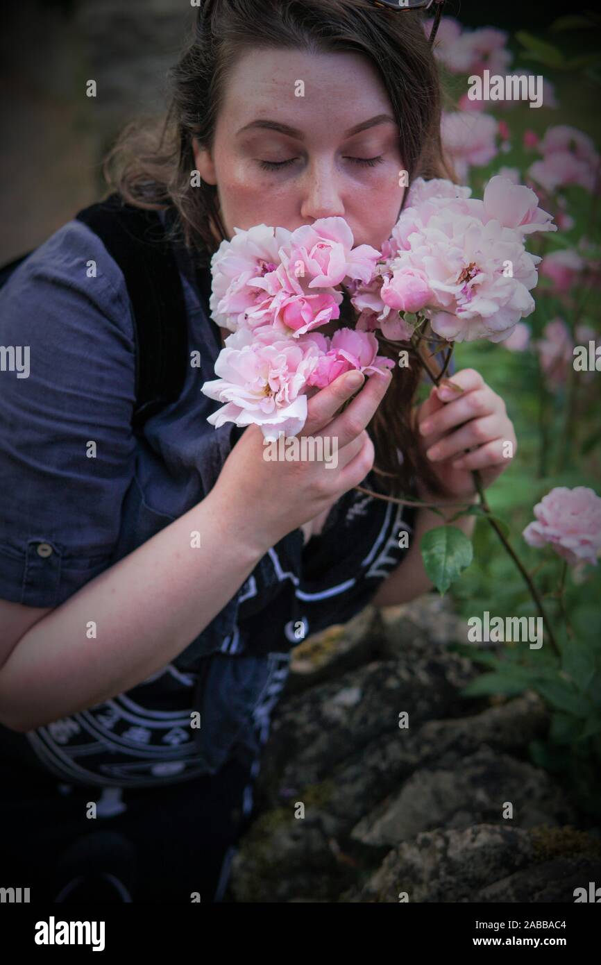 Woman smelling roses hires stock photography and images Alamy