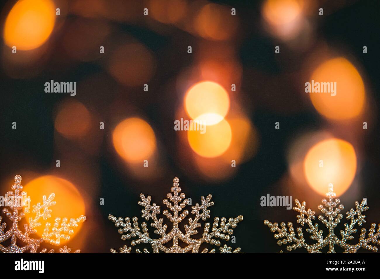 Blurred defocused black Christmas and New Year's background with golden ...